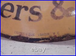 A vintage enamel advertising sign double sided A vintage enamel advertising sign double sided