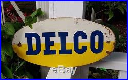 Vintage DELCO Batteries Parts Oval Enamel Steel Advertising Sign