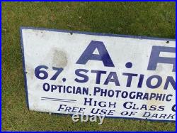 Vintage antique Enamel Advertising Sign Optician Binoculars Harrogate camera Old